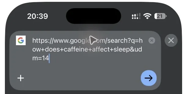 Chrome address bar on iPhone showing a Google search URL that contains udm=14
